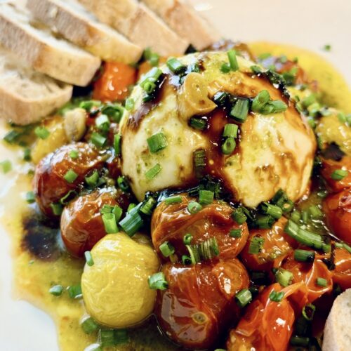 Basil Pesto Burrata & Roasted Cherry Tomatoes with roasted garlic and a drizzle of balsamic glaze